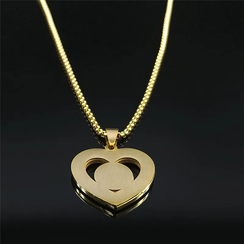 Gold heart-shaped pendant necklace on a black background