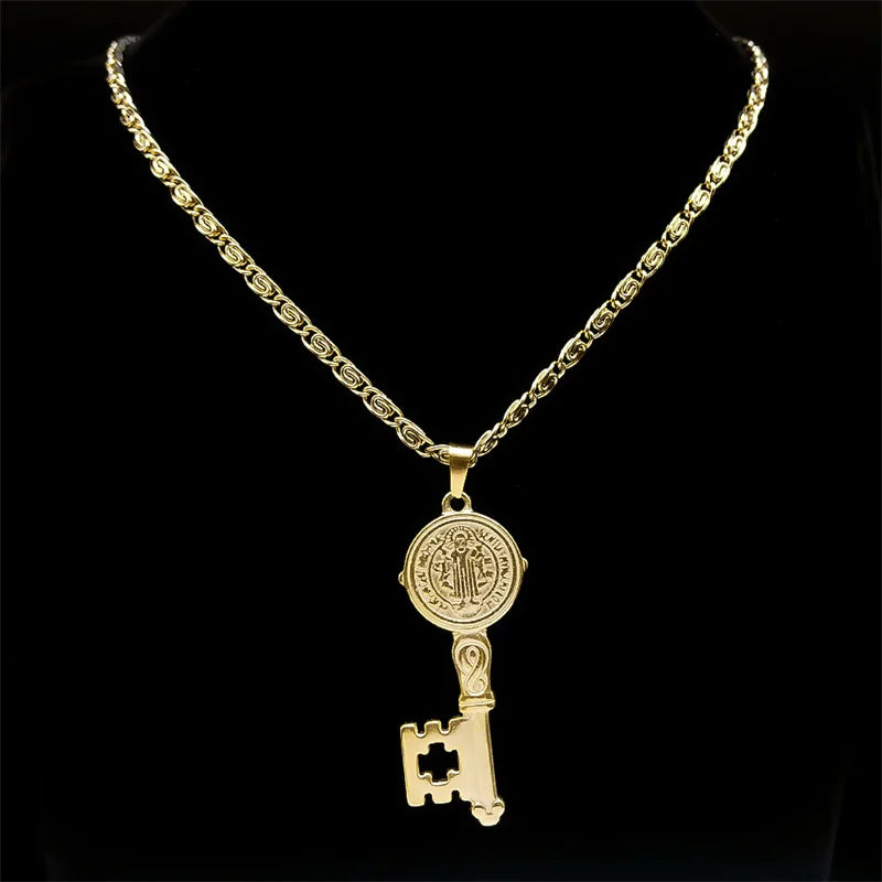 Gold necklace with a key-shaped pendant on a black background