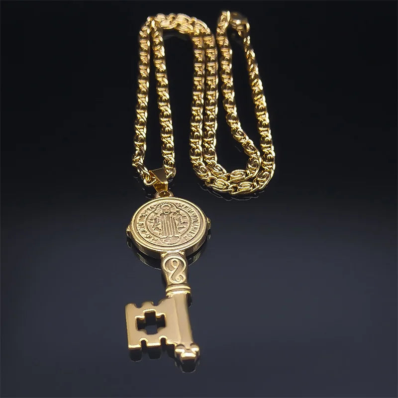 Gold key-shaped pendant on a chain against a dark background