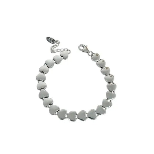 Silver heart-shaped bracelet on a white background