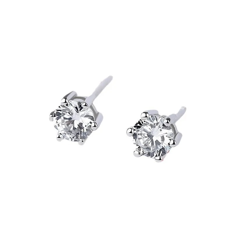 Pair of diamond stud earrings on a white background