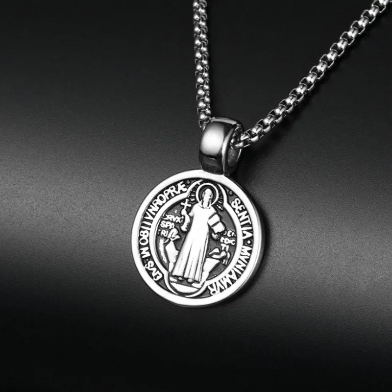 Silver pendant necklace on a dark background