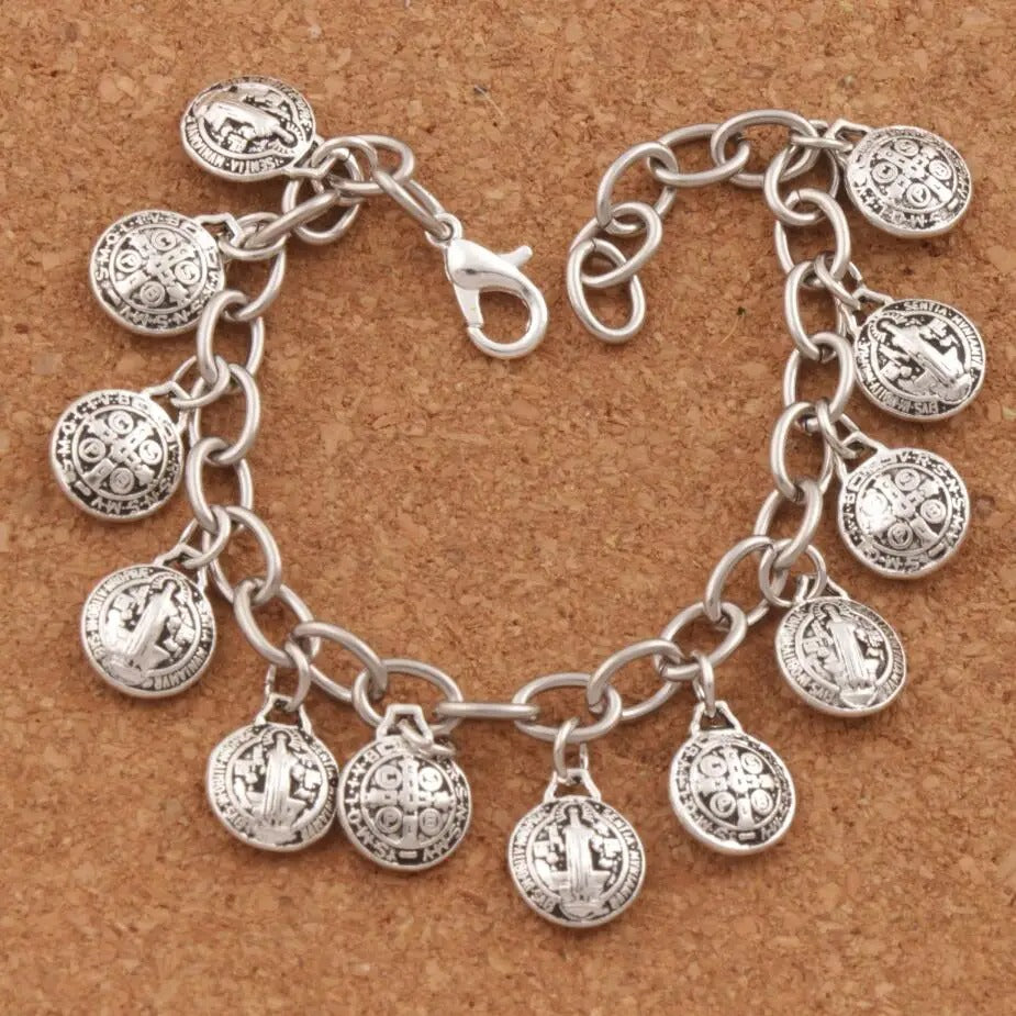 Silver charm bracelet on a brown background