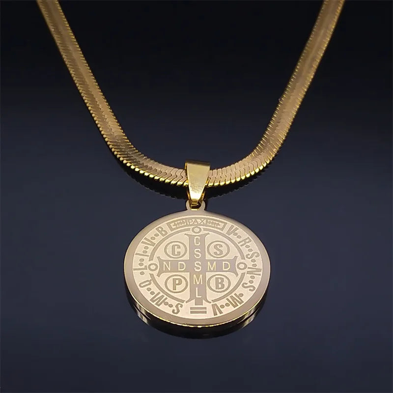 Gold necklace with a round pendant on a dark background
