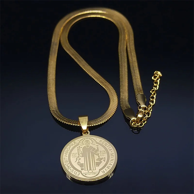 Gold necklace with a detailed pendant on a dark background