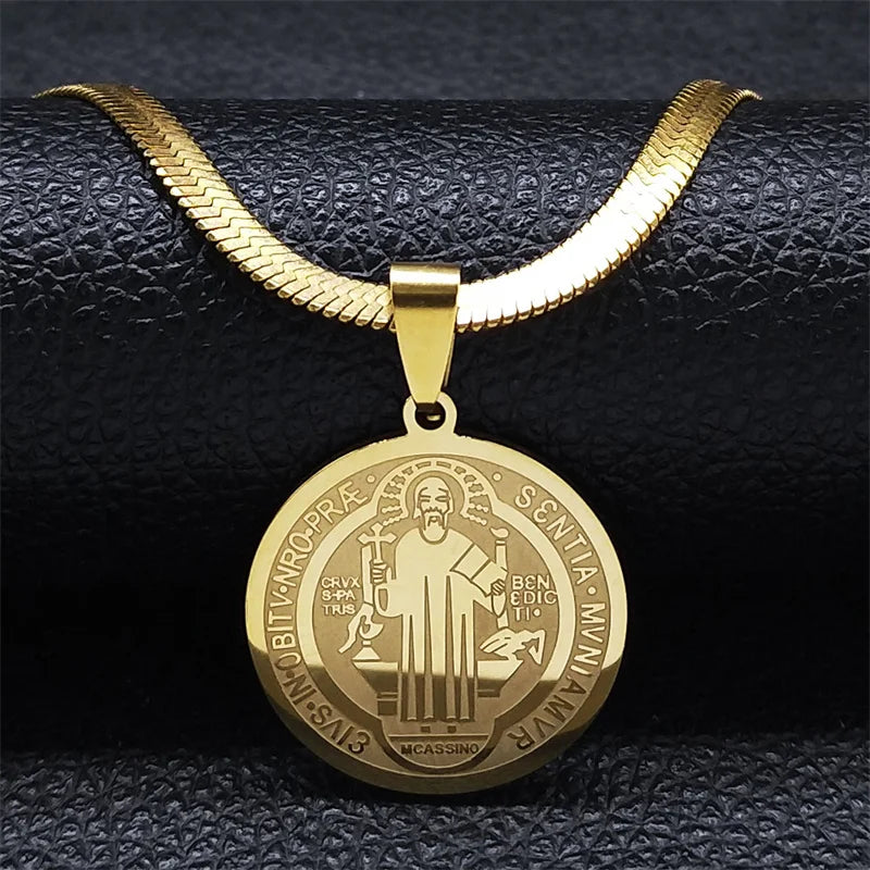 Gold necklace with a detailed pendant on a black textured background