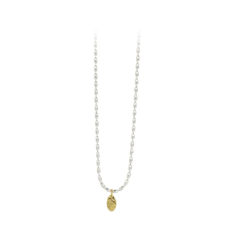 Necklace with a gold pendant on a white background