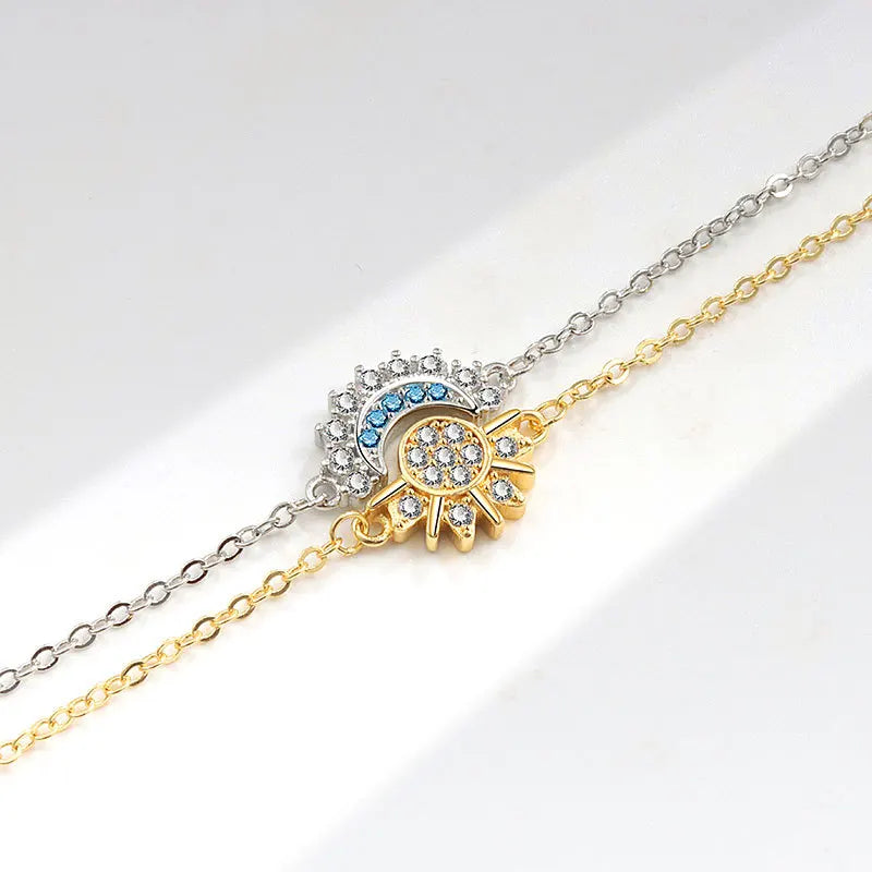 Two chain necklaces with eye-shaped pendants on a white background