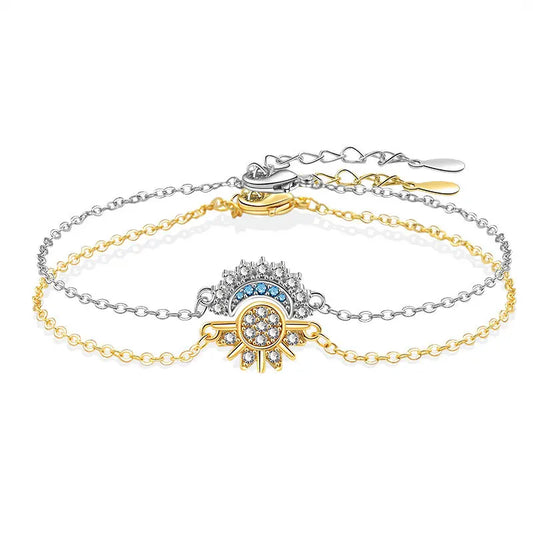 Gold and silver bracelet with decorative elements on a white background