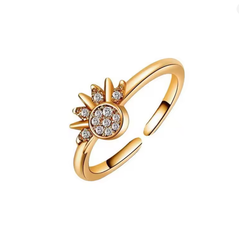 Gold ring with diamond accents on a white background
