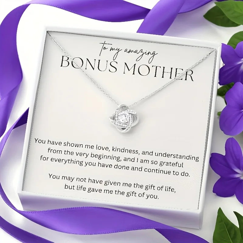 Necklace with a card for 'Bonus Mother' surrounded by purple ribbons and flowers