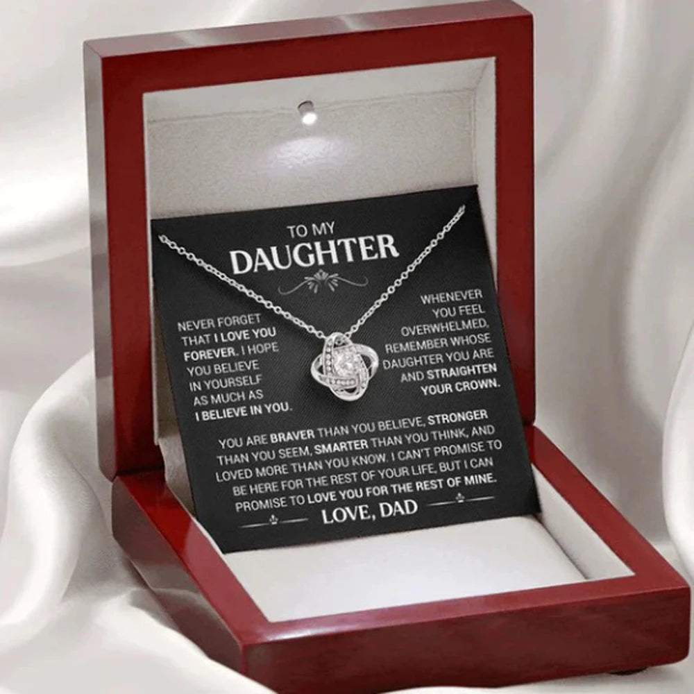 Necklace with a sentimental message card in a red box on a white background