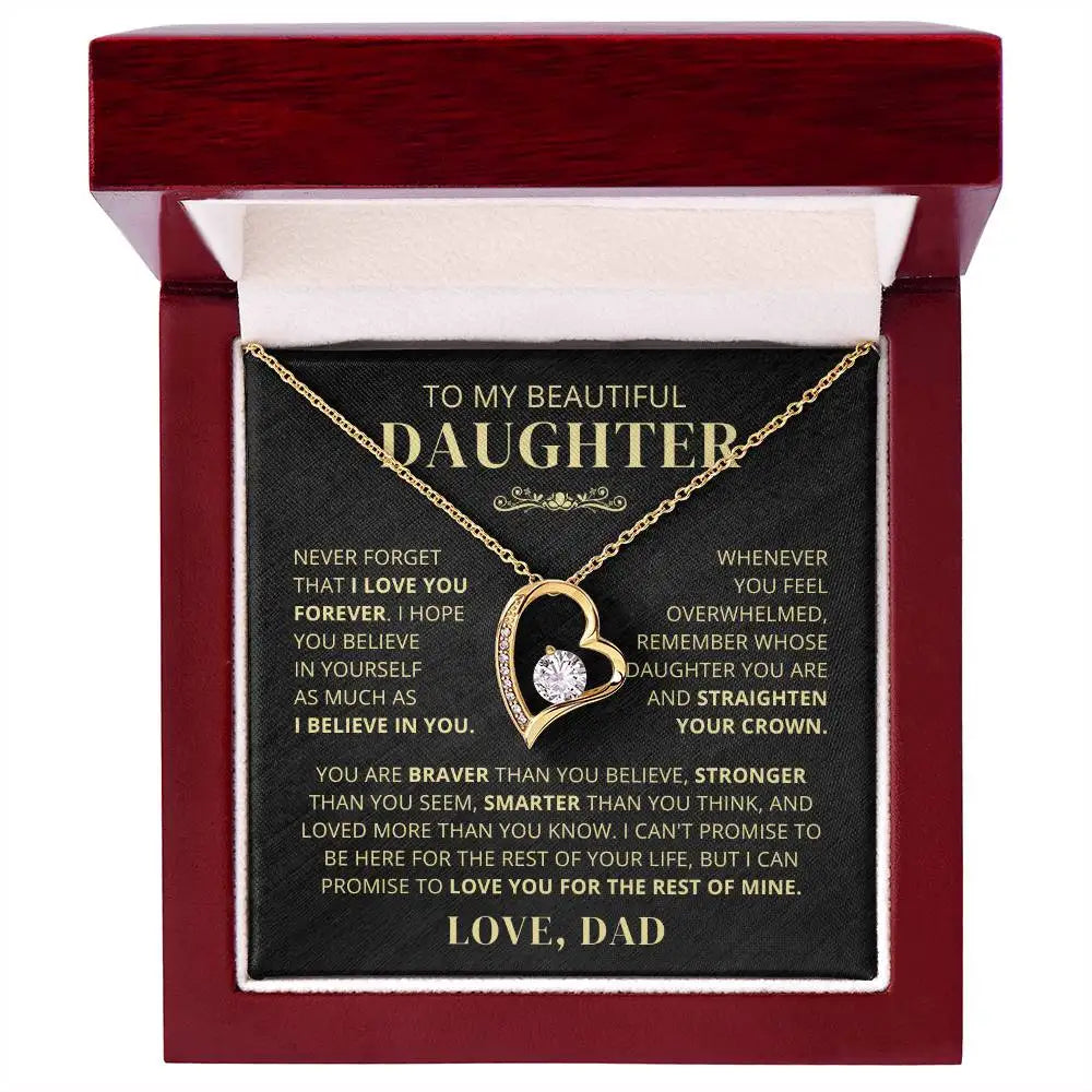 Gold heart-shaped necklace with a message card in a red box