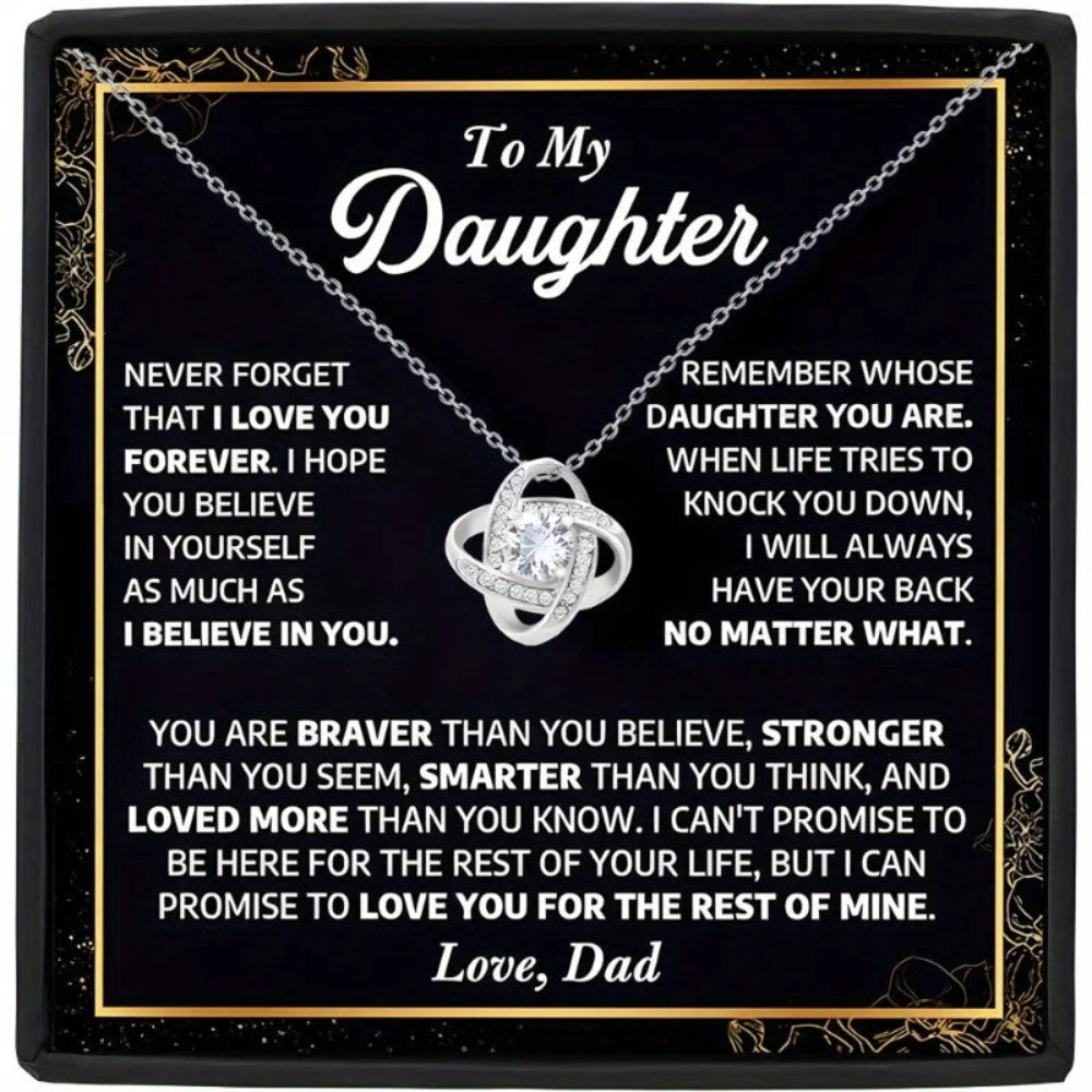 Necklace with sentimental message to daughter on a black background