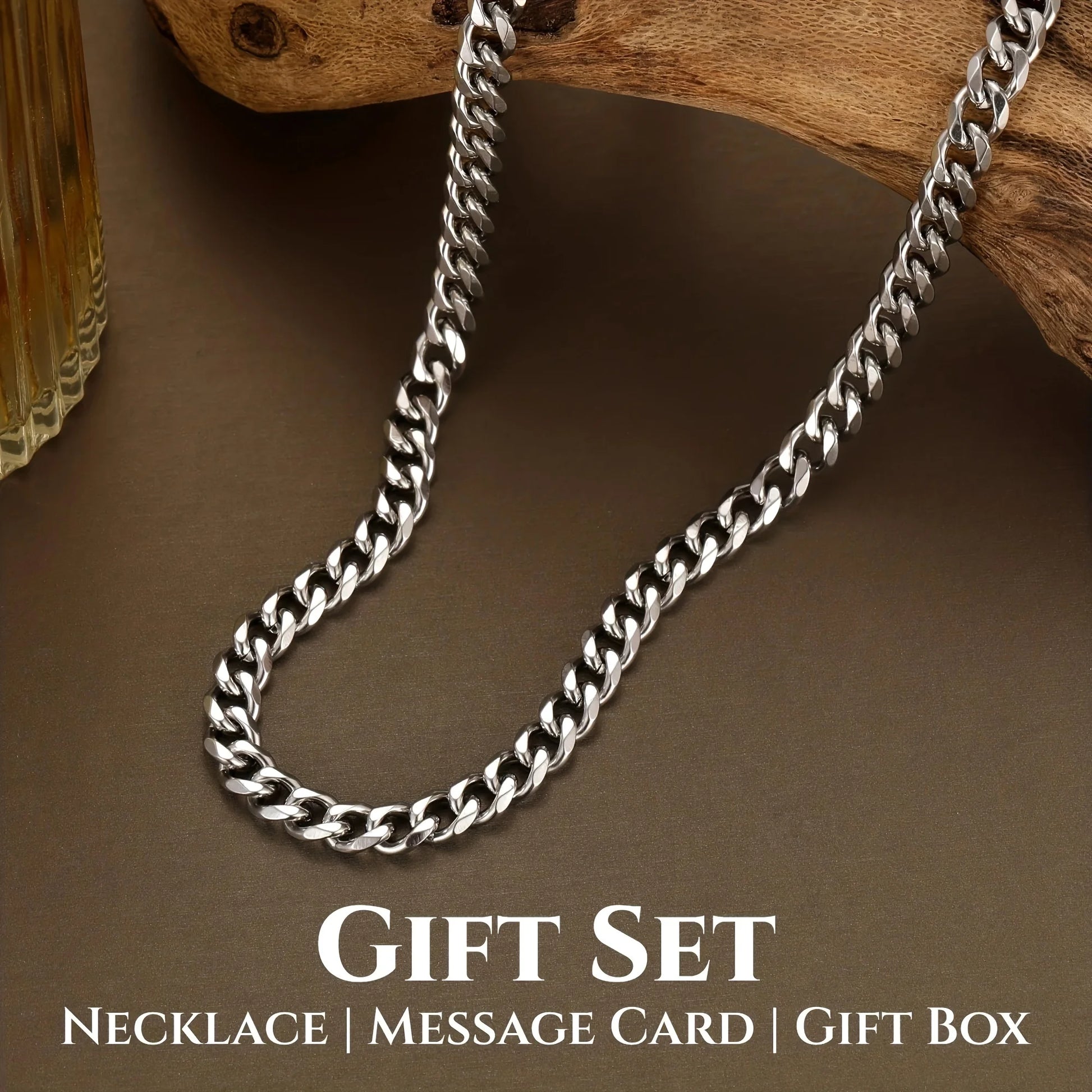 Silver chain necklace on a wooden surface with 'Gift Set' text below.