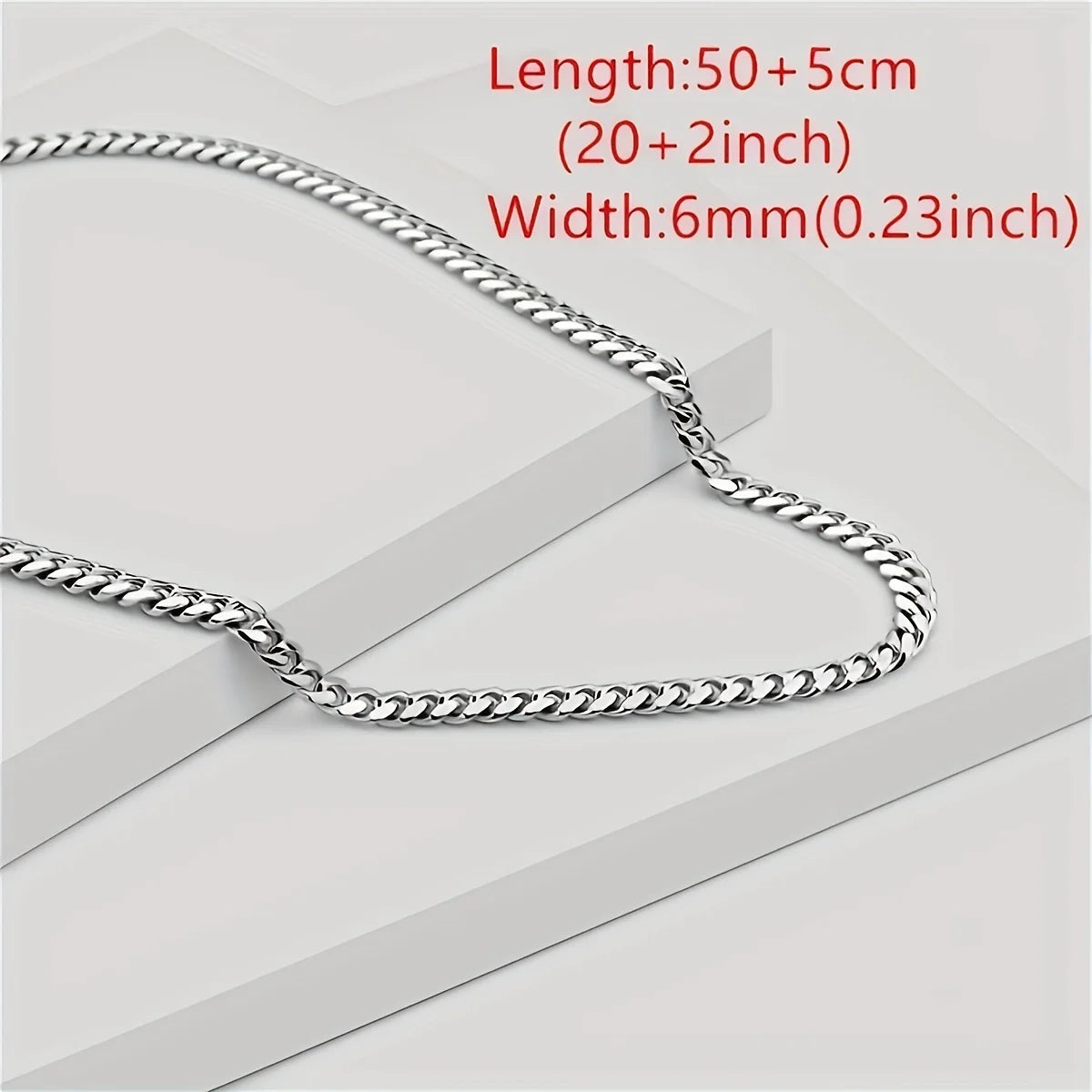 Silver chain necklace with measurement text on a light gray background
