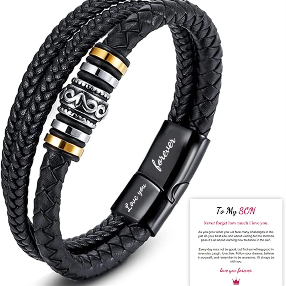 Black braided leather bracelet with metal clasp and engraved message on a white background