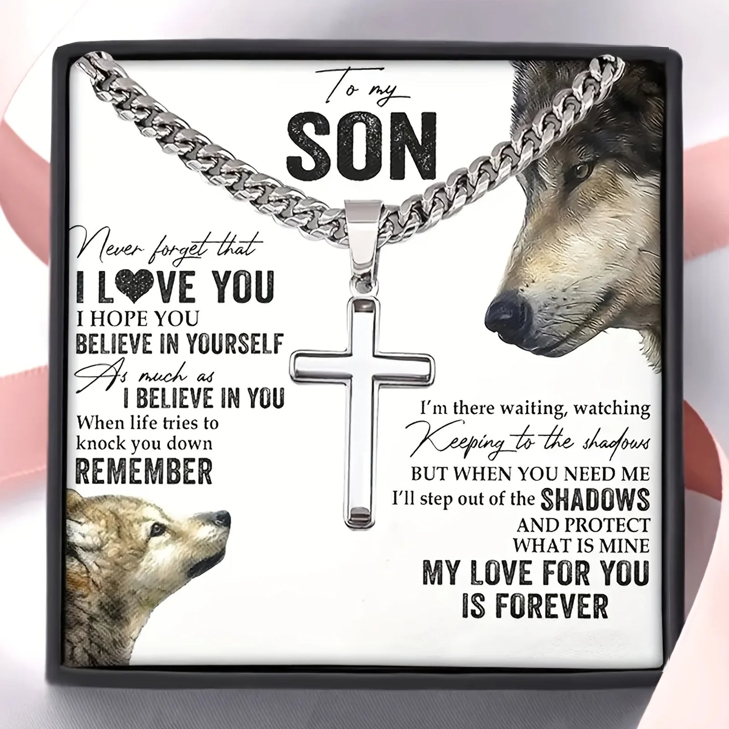 Wolf-themed necklace with cross pendant and sentimental message on a white background