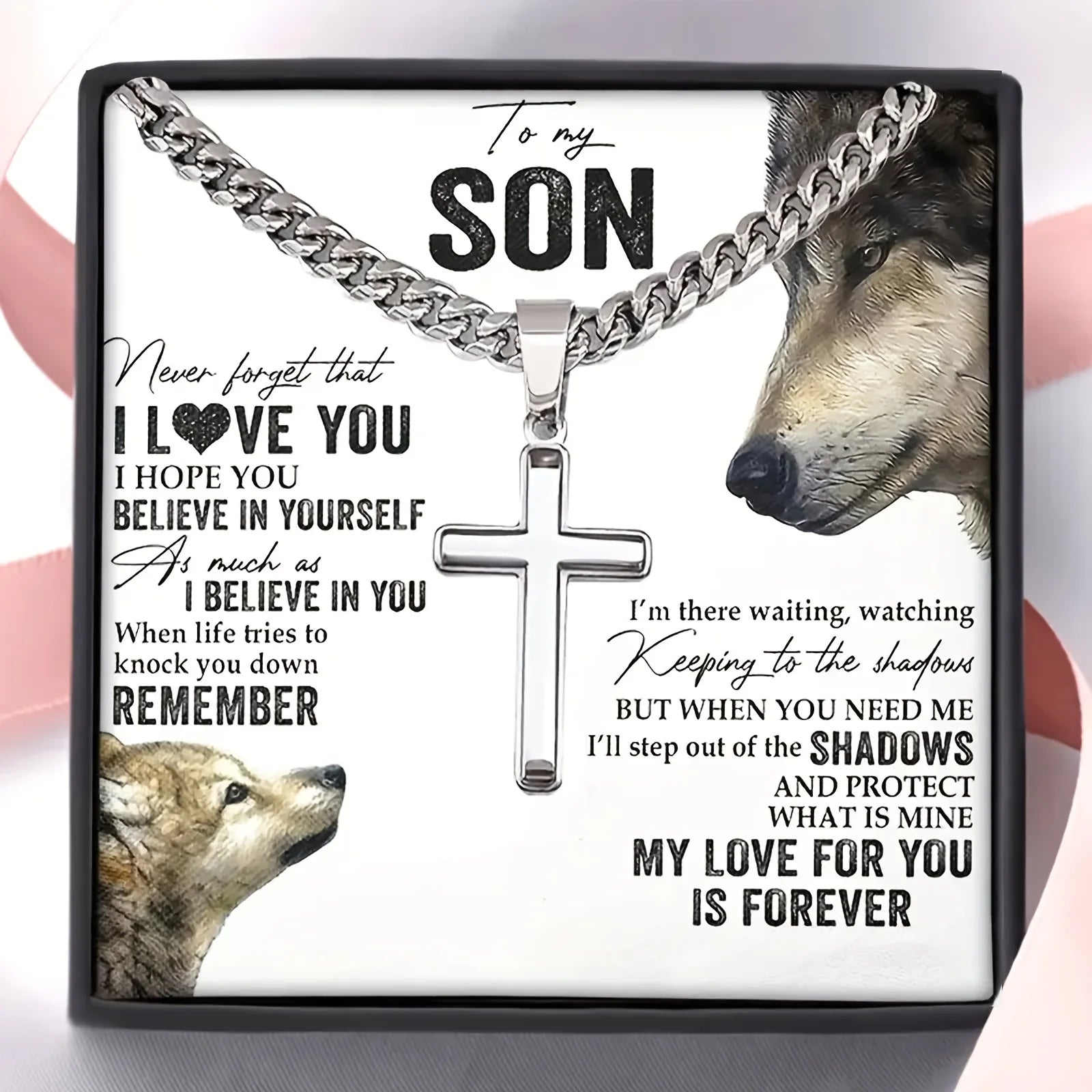 Wolf-themed necklace with cross pendant and sentimental message on a white background