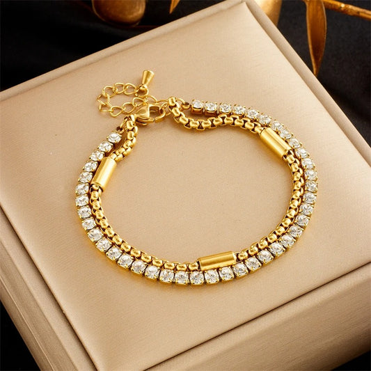 Gold bracelet with diamonds on a beige jewelry box