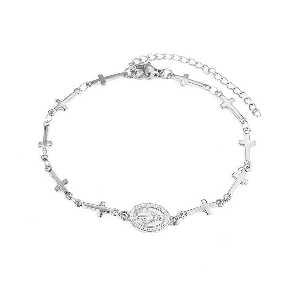 Silver bracelet with cross designs on a white background