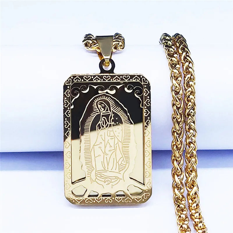 Gold pendant with chain on a white background